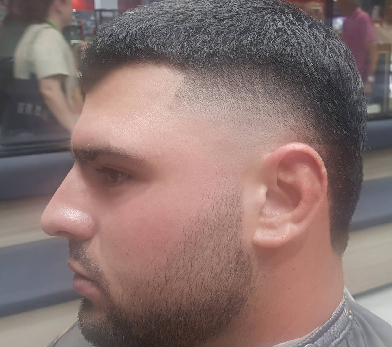 Skin fade with detailed line design at Al Barber Shop