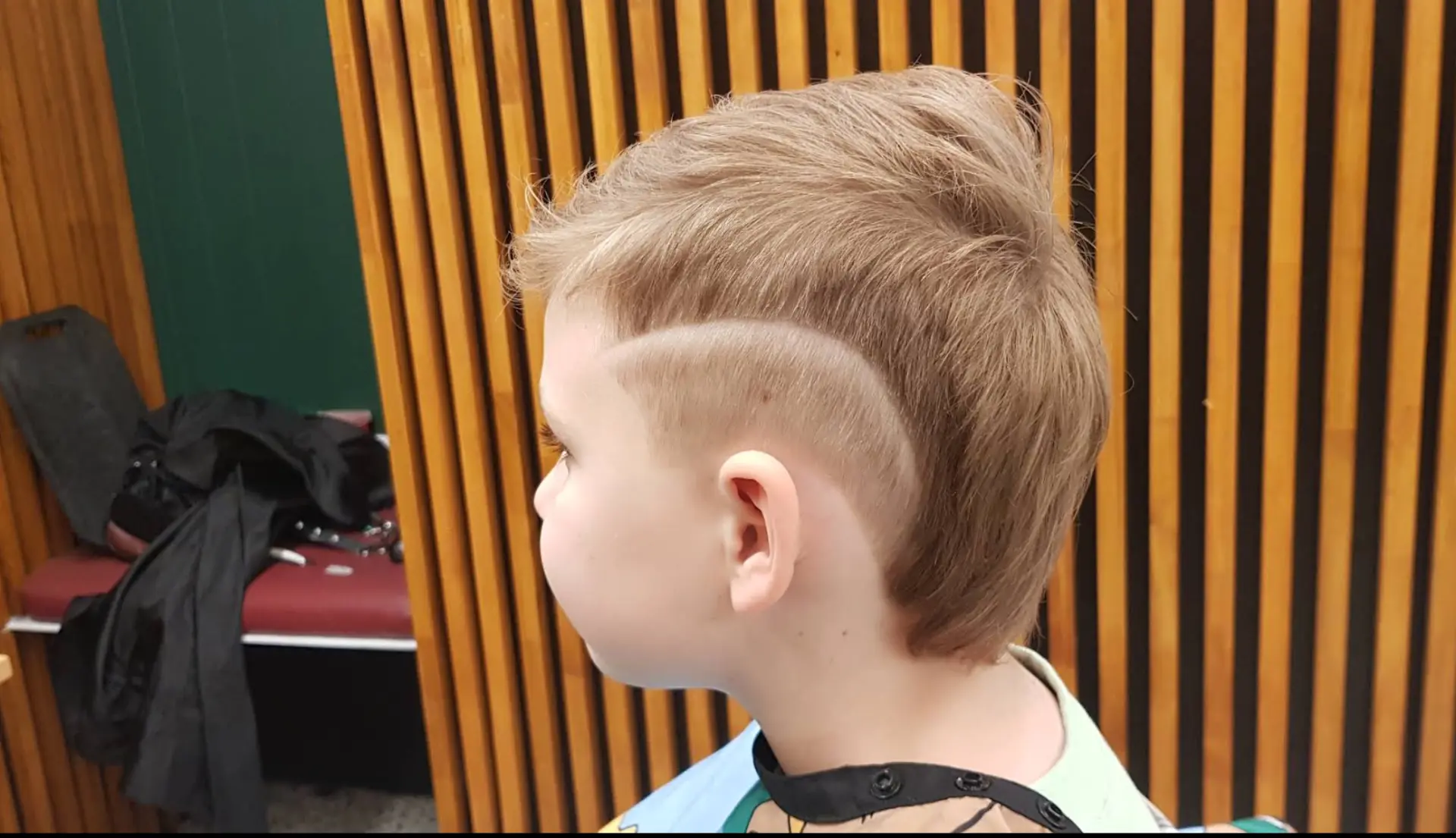 Kids’ haircut with sharp fade design at Al Barber Shop